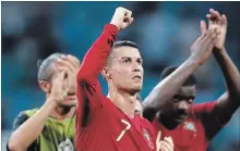  ?? FRANCISCO SECO THE ASSOCIATED PRESS ?? Fiat factory workers in Italy want their owner to spend $130 million on job-boosting investment­s like making better cars rather than soccer star Cristiano Ronaldo, above.