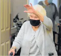  ?? ?? Kane waves to the crowd who gathered Thursday to celebrate her 100th birthday at Smith Crossing.