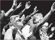  ?? MARK WEBER/THE COMMERCIAL APPEAL ?? Eileen Bartlett of Nesbit, Miss., prays during the Memphis Exalts Jesus event Saturday afternoon at AutoZone Park.