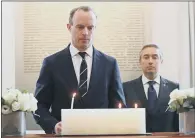  ?? PICTURE: PA ?? IN MEMORY: Foreign Secretary Dominic Raab lights a candle at Canada House, for passengers of the Ukrainian passenger jet victims.