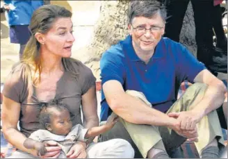  ?? AFP FILE ?? ■ From left: Melinda Gates, co-founder of the Bill & Melinda Gates Foundation, with her husband and Microsoft founder Bill Gates during their visit to a village at Patna, Bihar, on March 23, 2011.