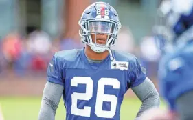  ??  ?? New York Giants running back Saquon Barkley looks on during training camp July 26 in East Rutherford, N.J. VINCENT CARCHIETTA/USA TODAY SPORTS