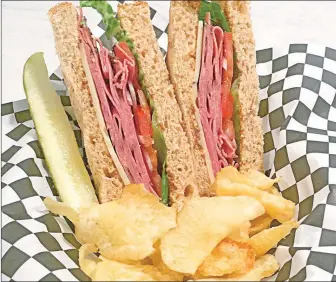  ??  ?? The “Ramo Ruben” includes a mounding helping of corned beef, cheese, peppers and is served with their homemade slaw or chips.
dining.nwadg.com
| Advertisin­g Supplement
|
Friday, October 20, 2017 |