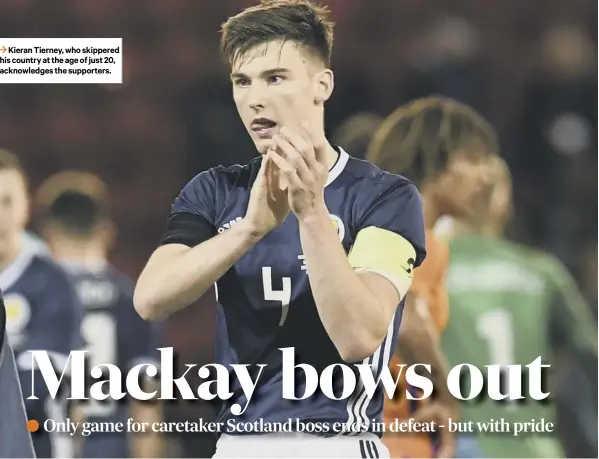  ??  ?? 3 Kieran Tierney, who skippered his country at the age of just 20, acknowledg­es the supporters.
