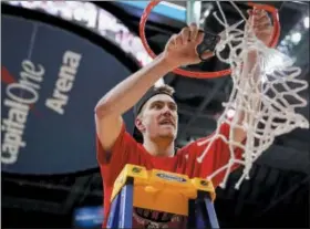  ?? ANDREW HARNIK — THE ASSOCIATED PRESS ?? Davidson forward Peyton Aldridge (23) cuts the net down after an NCAA college basketball championsh­ip game against Rhode Island in the Atlantic 10 Conference tournament, Sunday.