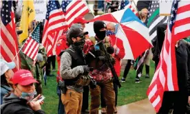  ?? Photograph: Jeff Kowalsky/AFP via Getty Images ?? Armed protesters during a demonstrat­ion in Lansing, Michigan, on 30 April.