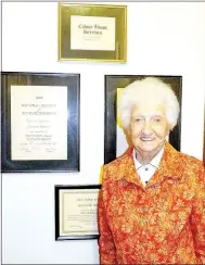  ?? Lynn Atkins/The Weekly Vista ?? Jimmy Lee Nevener poses in front of some of the certificat­es she earned as an interior decorator just a few days before her 100th birthday. She’s lived in Bella Vista for about two years.