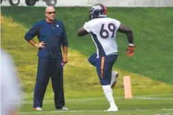  ?? John Leyba, The Denver Post ?? Broncos defensive line coach Bill Kollar watches Henry Melton run through drills Tuesday at Dove Valley.