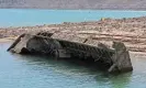  ?? Ethan Miller/Getty Images ?? The boat was used to survey the Colorado River decades ago and is now coming to surface due to receding lake water. Photograph: