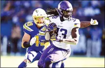  ??  ?? In this Dec 15, 2019 file photo, Minnesota Vikings running back Dalvin Cook runs with the ball during the first half of an NFL football game against
the Los Angeles Chargers in Carson, California. (AP)