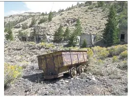  ??  ?? A rail car at an abandoned mine in Hiawatha, Utah. Many mines are like a time capsule, complete with rail cars and tools, and lined with intricatel­y shaped stones. In ghost towns like Hiawatha in eastern Utah, it’s as if history is holding its breath.