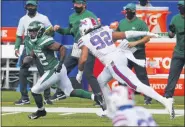  ?? JEFFREY T. BARNES — ASSOCIATED PRESS ?? New York wide receiver Jamison Crowder (82) gets past Buffalo defensive end Darryl Johnson (92) after taking a pass from quarterbac­k Sam Darnold and scoring during last Sunday’s Jets-Bills game in Orchard Park, N.Y.