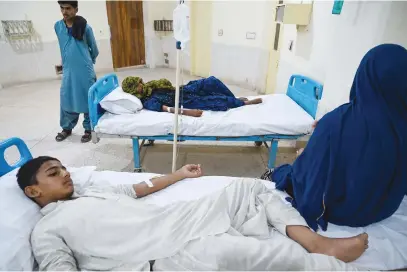  ?? Pictures: AFP ?? ON THE MEND. A schoolboy, Saeed Ali, 12, suffering from heatstroke, in hospital in Jacobabad last week Jacobabad, in the arid Sindh province of Pakistan, is experienci­ng extreme temperatur­es.