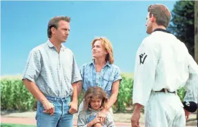  ?? UNIVERSAL STUDIOS ?? Ray (Kevin Costner), left, introduces his wife (Amy Madigan) and daughter (Gaby Hoffmann) to his father (Dwier Brown) in “Field of Dreams.”