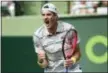  ?? GASTON DE CARDENAS — THE ASSOCIATED PRESS ?? John Isner celebrates after beating Hyeon Chung on Wednesday in Key Biscayne, Fla. Isner won 6-1, 6-4.