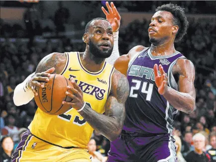  ?? Kelvin Kuo ?? The Associated Press Lebron James leads his newest team, the Los Angeles Lakers, against defending champion Golden State on Wednesday at T-mobile Arena.