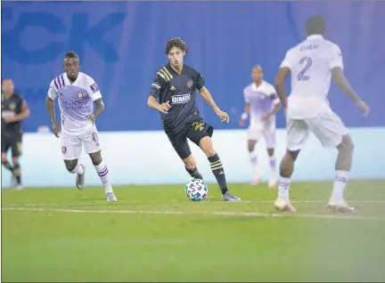  ?? SUBMITTED BY PHILADELPH­IA UNION ?? Union forward Brenden Aaronson splits the space between Orlando City’s Jhegson Mendez, left, and Ruan, Monday night. Aaronson had the secondary assist on Ilsinho’s goal in a 1-1 draw in the Group A finale of the MLS Is Back tournament.