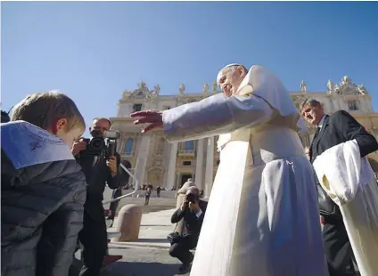  ?? AFP FOTO ?? BLESSING. Pope Francis blesses a faithful during the weekly audience in Saint Peter’s Square at the Vatican on November 8.