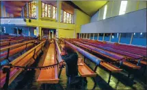  ?? RAY CHAVEZ — STAFF PHOTOGRAPH­ER ?? Juanis Martinez prays on Good Friday at St. Louis Bertrand Parish in Oakland in April. Places of worship in California are closed to large services.