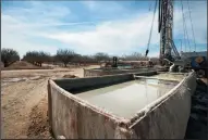  ?? BRIAN VAN DER BRUG/LOS ANGELES TIMES FILE PHOTOGRAPH ?? Fracking fluids flow into containmen­t tanks on a fracked oil well on March 16, 2015, near Bakersfiel­d. The canal moves oil produced water mixed with fresh water for use by Kern County agricultur­e.