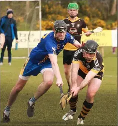  ??  ?? Bobby Hughes of Tara Rocks applying pressure on Colm Kennelly (Ballygarre­tt) in their meeting in Gorey on Saturday.