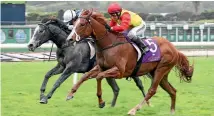  ?? PHOTO: TRISH DUNELL ?? Xiong Feng (outside) winning the Karaka Million race at Ellerslie earlier this year.