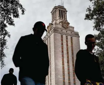  ?? NickWagner / American-Statesman file photo ?? Students walk past the tower at the University of Texas, which Alberto Martinez, a history of science professor, has accused of a “relentless campaign” to deter his efforts.