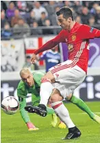  ?? Picture: AP. ?? Henrikh Mkhitaryan scores the opening goal past Anderlecht goalkeeper Ruben Martinez.