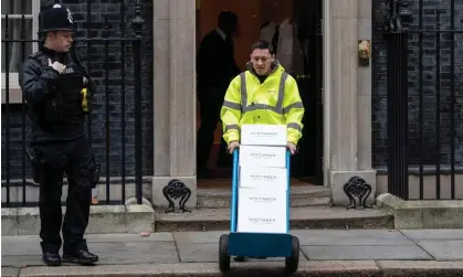  ?? ?? Let the bottles pile high: a man delivers champagne-style sparkling wine at Downing Street on 23 January 2020. Photograph: Leon Neal/ Getty Images