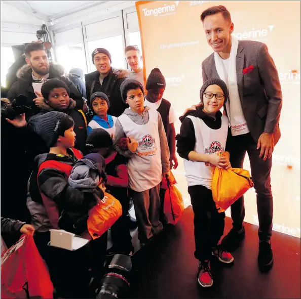  ?? MICHAEL PEAKE/TORONTO SUN ?? Victoria’s Steve Nash meets with kids as part of a promotion at Dundas Square in Toronto for his charity and banking company Tangerine to kick off NBA all-star weekend in the city. The Inside the NBA crew was also in town filming before the weekend.