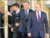  ?? REUTERS ?? Argentine President Mauricio Macri welcomes Russia’s President Vladimir Putin at the Casa Rosada Presidenti­al Palace in Buenos Aires on Saturday.