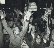  ?? UPI ?? This is just one of the scenes of jubilation in the streets on Lake Placid on Feb. 22, 1980 after the U.S. hockey team upset the powerful Soviet team in a semifinal game at the Winter Olympics.