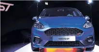  ?? LUKE MACGREGOR/BLOOMBERG SERVICES ?? Ford announced it is dropping most cars, like the Fiesta ST, pictured, and others. The automobile was shown last year during a launch event ahead of the 87th Geneva Internatio­nal Motor Show in Switzerlan­d.