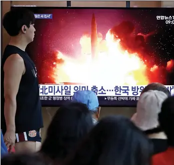  ?? Picture: CHUNG SUNG-JUN/GETTY ?? CONCERN: People in South Korea’s capital Seoul watch TV images of the launch