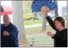  ?? MICHILEA PATTERSON — DIGITAL FIRST MEDIA ?? Tai Chi instructor­s Stewart Cleaver and Betsy Chapman use fans during a demonstrat­ion at Boyertown Community Park.