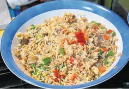  ?? ?? Fried rice mixed with chopped green and red peppers, chestnut mushrooms and bird eye chillies.