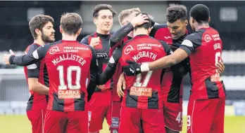  ??  ?? All in this together
St Mirren players congratula­te goalscorer Jamie McGrath