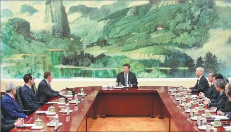  ?? FENG YONGBIN / CHINA DAILY ?? President Xi Jinping speaks with US Trade Representa­tive Robert Lighthizer, third from left, US Treasury Secretary Steven Mnuchin, second from left, from the US economic and trade team at the Great Hall of the People in Beijing, on Friday