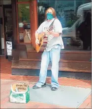  ??  ?? Johnny “Guitar” Carr performs outside the Good Nature Market Thursday on Broadway in New Haven.