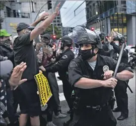  ?? Wally Skalij Los Angeles Times ?? A REQUEST by Black Lives Matter-Los Angeles and other litigants to ban the use of batons and kinetic projectile­s on protesters was denied Tuesday by a judge.