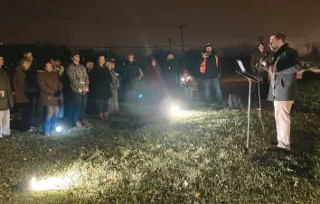  ?? ?? Brian Westbrook, right, founder and executive director of Coalition for Life St. Louis, speak Dec. 1, 2021, during a prayer vigil next to a Planned Parenthood facility in Flossmoor.