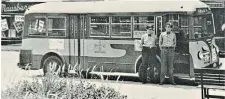  ?? ?? Brothers-in-law Harold Appell and Sanford Fischer show off their spiffy Public Utilities Commission uniforms. The No. 22 bus, one of the new Yellow Coach vehicles purchased by the PUC in 1939, is parked in front of Kitchener City Hall.