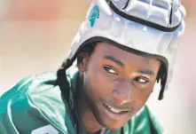  ?? Carlos Avila Gonzalez / The Chronicle ?? De La Salle’s Charles McAdoo sports a padded helmet worn by the team at a 7-on-7 tournament in Pittsburg in the summer.