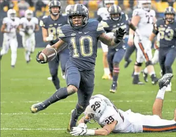  ??  ?? Quadree Henderson returned four kickoffs and three punts for touchdowns in his time at Pitt, including this one in October against Virginia.