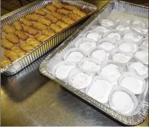  ?? FILE ?? Pans of Koulouria (a Greek butter cookie) and Kourambied­es (a soft butter cookie with powder sugar) from a previous Dayton Greek Festival.