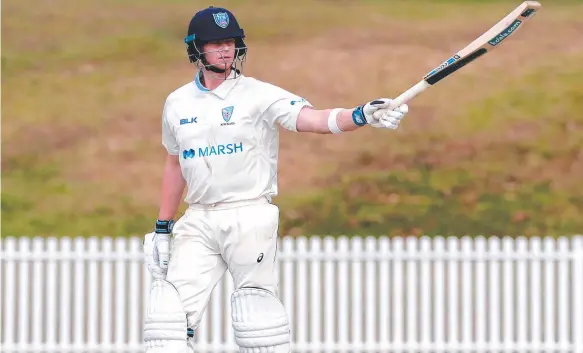  ?? Picture: AAP ?? NSW batsman Steve Smith celebrates reaching his century during day two of the Sheffield Shield clash with Tasmania at Drummoyne Oval in Sydney