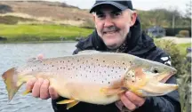  ??  ?? WHOPPER This huge brownie was a spectacula­r catch