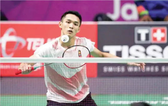  ?? — Reuters ?? Jonatan Christie of Indonesia goes for a shot against Chou Tienchen of Taiwan.