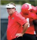  ?? JOHN BAZEMORE — ASSOCIATED PRESS ?? Georgia head coach Kirby Smart watches drills during the team’s first practice Friday in Athens, Ga.