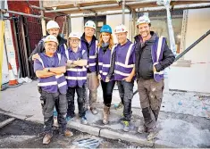  ??  ?? Changing lives: Nick Knowles (right) and his team were in Warwickshi­re